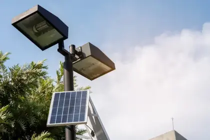 Solar-powered street light against a clear sky